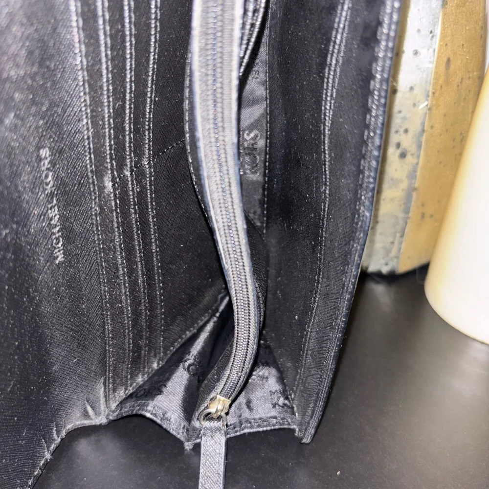 Michael Kors Fulton Large Flap Continental Wallet in black pebbled leather.
